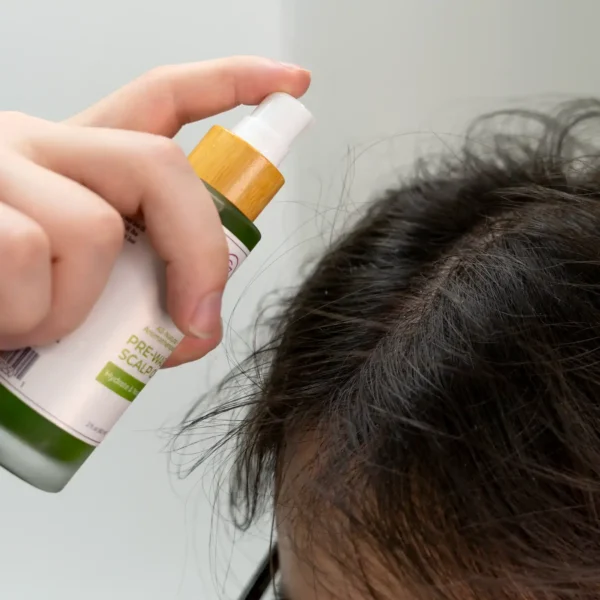 Man applying Pre-Wash Scalp Oil to scalp