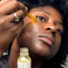 Woman applying Scentral Zone's Velvet Face Serum on face