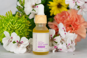 Scentral Zone Velvet Face Serum with flower background