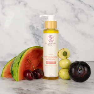 Scentral Zone's Replenishing Body Oil displayed with fresh ingredients